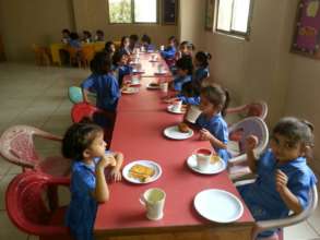 Children eating French toast in Kindergarten