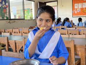 A student enjoys her Monday breakfast