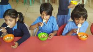 chowing down on chickpea salad with fruits