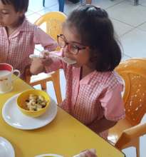 A student enjoys fruit salad