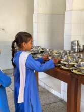 Students Standing in a Queue Collecting Their Meal