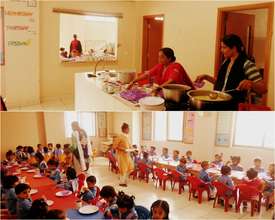 Teachers preparing and serving breakfast