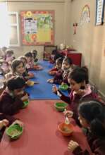 Kindergarten students enjoying their meal at SMB