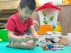 Creating with toys while telling stories.