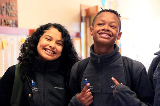 MIKE youth share smiles and health.
