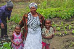 Household Gardener - Mrs Jeza with her children