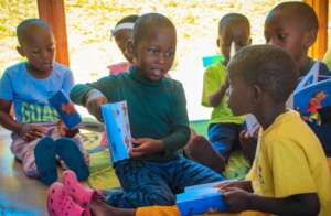 ECD children reading their new books right away