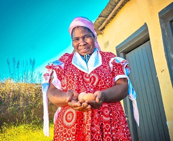 Pilot participant, Nomusa, with her hens' eggs