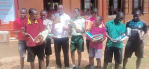 Health club boys  receiving the books