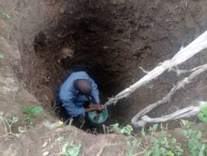 Digging the hole for their toilet
