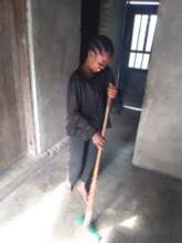 Tunu cleaning her newly renovated home