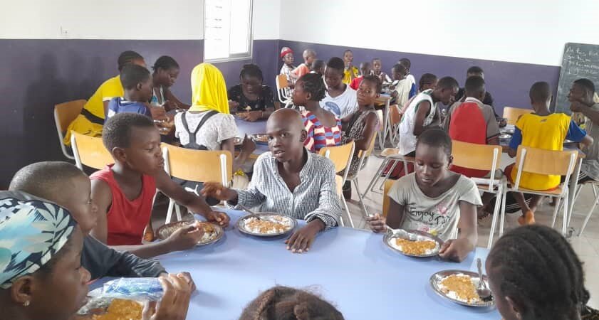 Children enjoy meals at our Guinea center