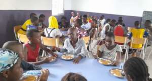 Children enjoy meals at our Guinea center