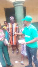 Our Project Leader giving out money to the widows