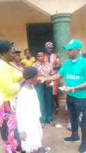 Our Project Leader giving out money to the widows