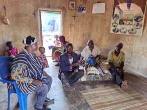 Community chief and elders meeting with partners.