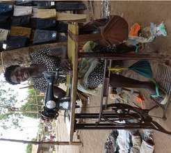 Susan working at Bweyale market for 1 per day
