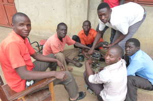 Mechanics students examine part of an Engine