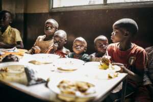 Children eating their meal.