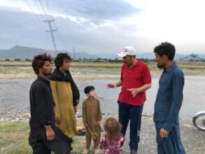Mr Murad Khan talks to community members.