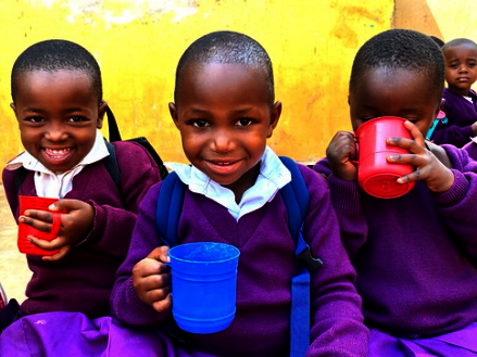 Orphans drinking milk