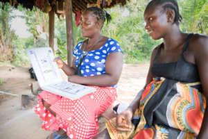 Grace provides counseling to a pregnant woman