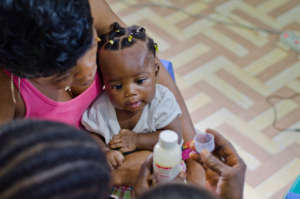 A CHA administers treatment to a patient