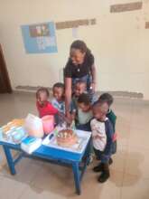Photo of kids and teacher during end year event