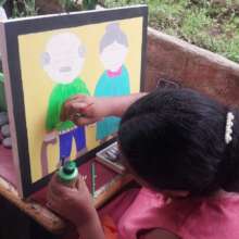 student working on art