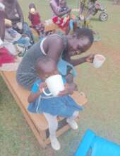 A child and his mother enjoying porridge