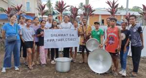 A youth volunteer group receives a kitchen set