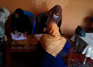 Women register for the program