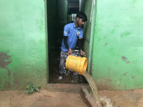 Baling water from kennels during early rains 2023