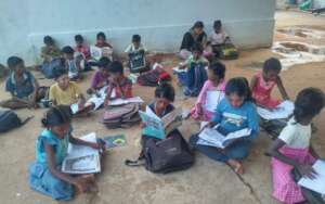 Buds' children doing homework