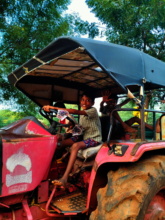 Playing (not driving!) on the tractor