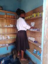 Our nurse stocking the pharmacy with vital needs