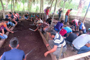 Youth working together to prepare raised beds
