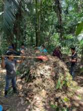 Youth producing compost from local materials