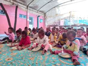 partial picture of  children at MHO  on feeding
