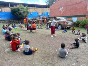partial picture of  children at MHO  otside play