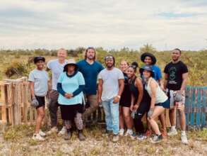 Our team volunteering to help build a fence