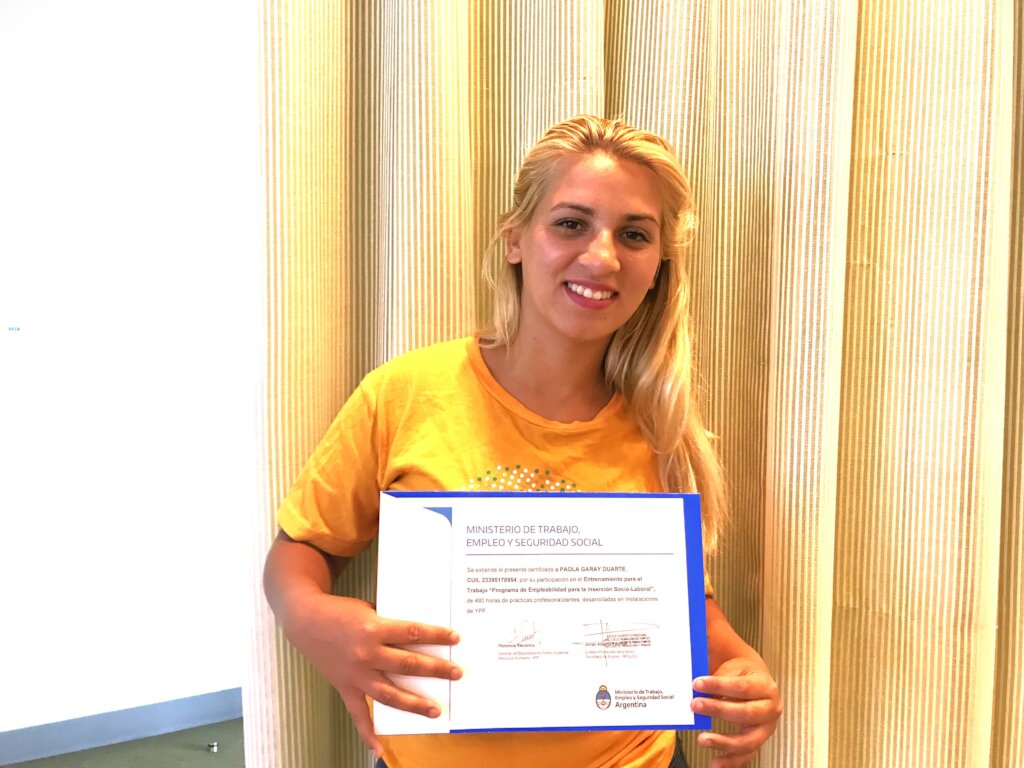 Paola with her certificate in Job Training