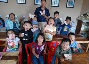 Students holding up butterfly anatomy craft