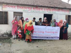 Trained teacher's  standing In front  their school