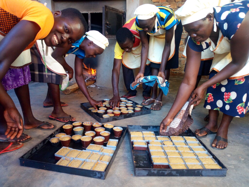 Women Producing Karacel Cake