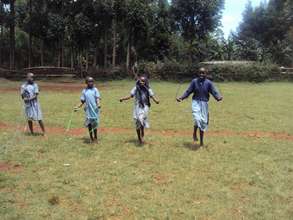 Nyakongo primary school pupils using the new items