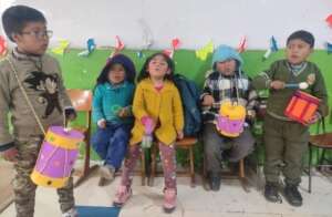 Young children participate in musical expression