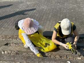Two volunteers were picking up the tiny foam waste