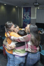 A hug between graduates