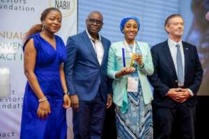 EHA Clinics team receiving the Award from the IIF
